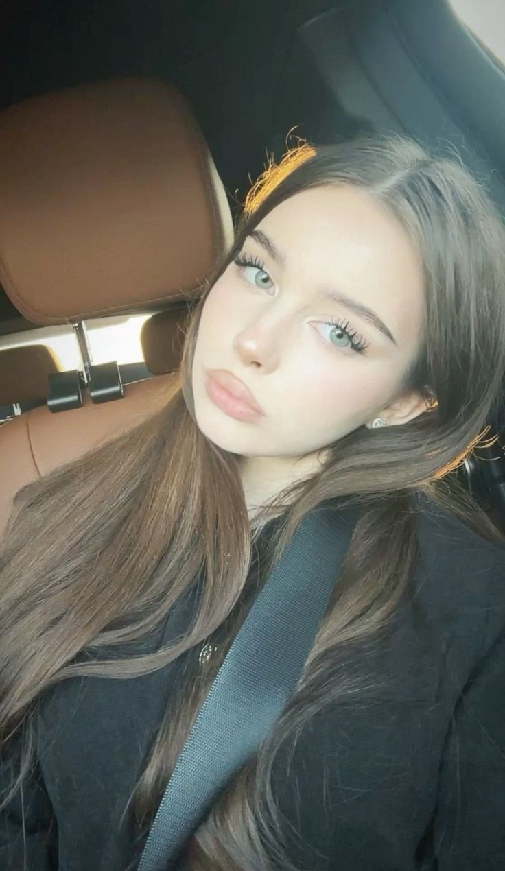 Woman in car with seatbelt