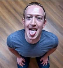 Mark Zuckerberg looking up at the camera, sticking his tongue out, with a blue tint to his tongue