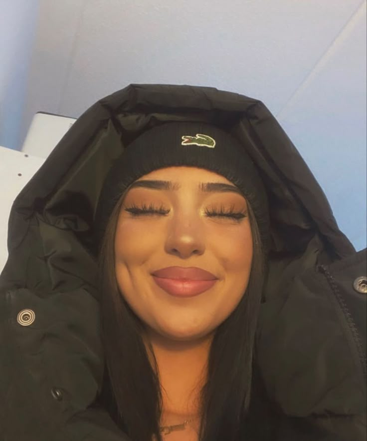 Woman in black beanie smiling